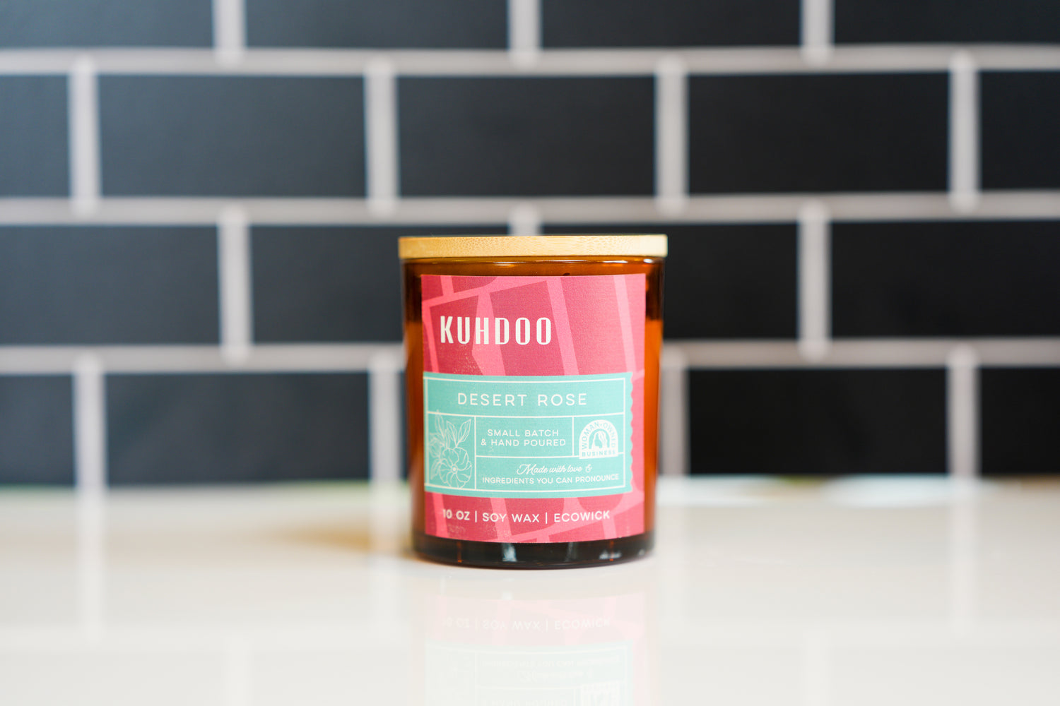 Desert Rose Candle hand poured in a glass container by Kuhdoo