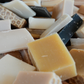 Assorted pieces of soap in various scents and textures.